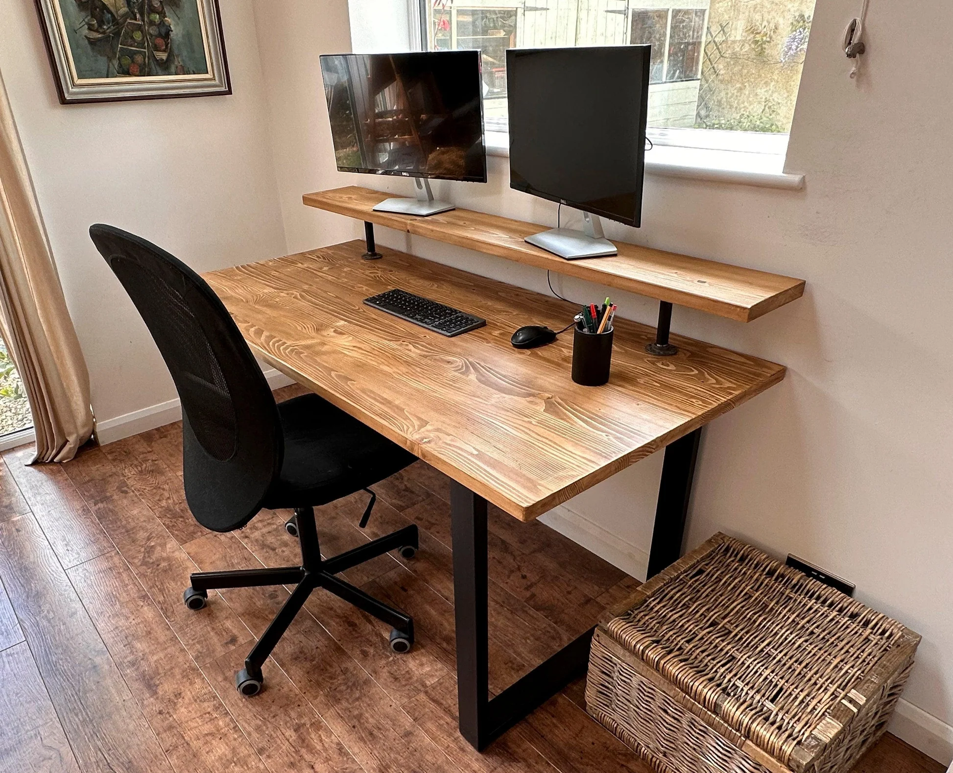 Wooden desk with monitor, lamp and small accessories